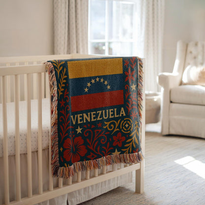Woven blanket with Venezuela flag, Venezuela text, stars, palm tree and red floral folk art