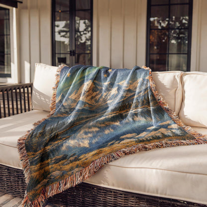 Alaska woven blanket with northern lights, mountain lake scene, gold stars, and fringe edges