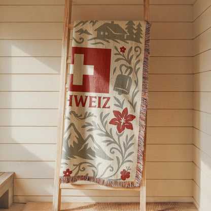 Woven blanket with Schweiz Swiss flag, alpine mountains, flowers, chalet, cowbell and ibex design