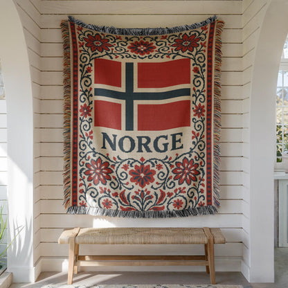 Woven blanket with Norway flag, NORGE text, red floral Nordic border, and fringe edges