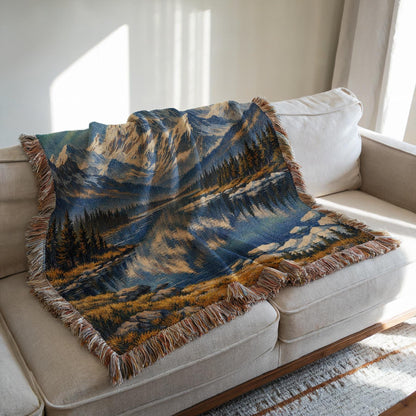 Alaska woven blanket with northern lights, mountain lake scene, gold stars, and fringe edges