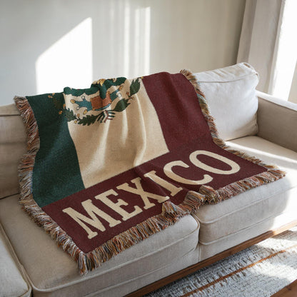 Woven blanket featuring the Mexico flag with eagle coat of arms and MEXICO text