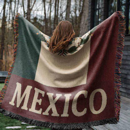 Woven blanket featuring the Mexico flag with eagle coat of arms and MEXICO text